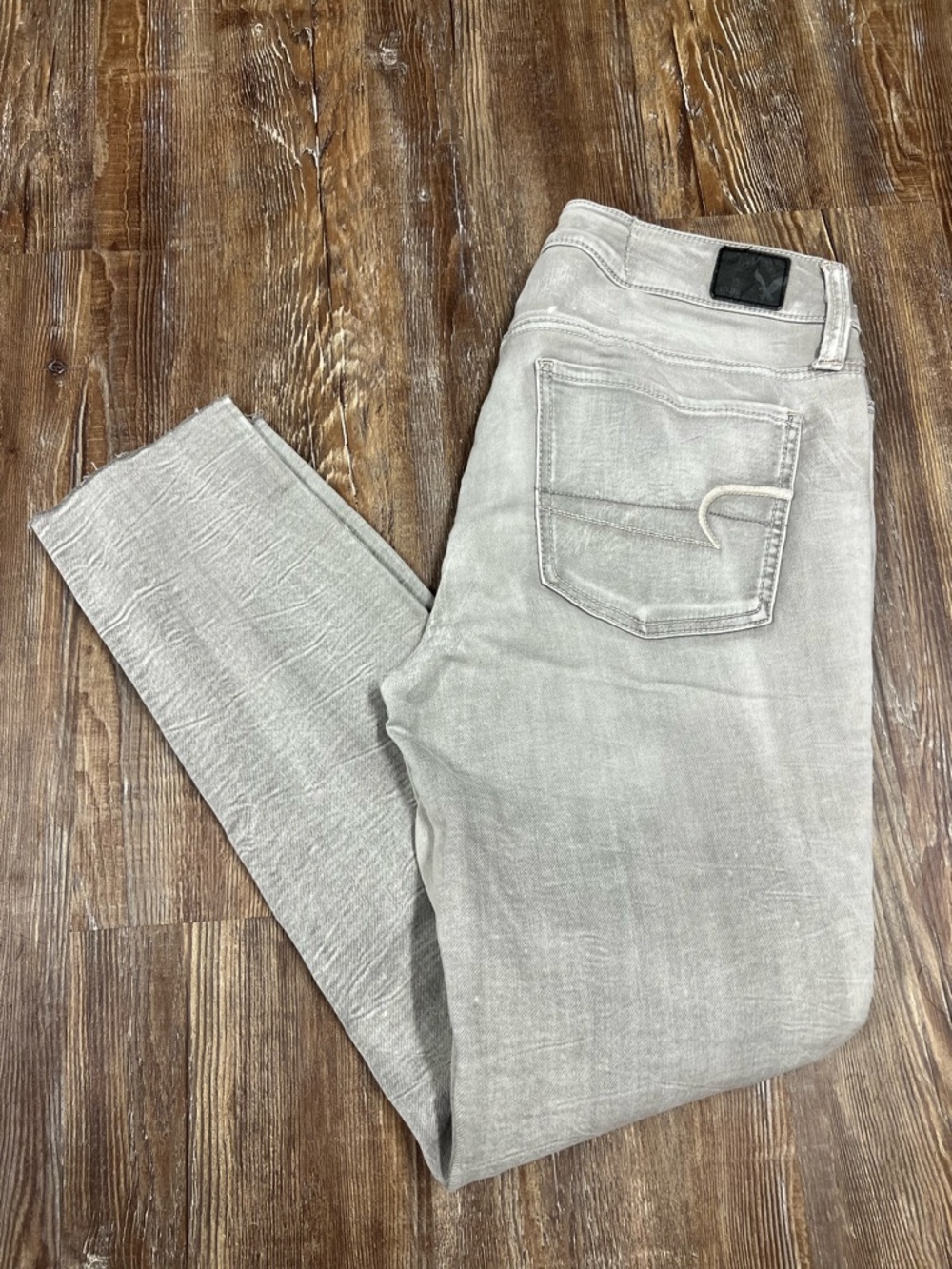 American Eagle Grey straight leg jeans with a distressed look